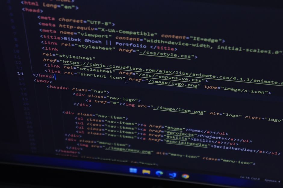 A code editor photographed at an angle, showing the <head> of an HTML page. One <link> tag loads animate.css 4.1.1 from cdnjs.cloudflare.com - and carries no integrity attribute, which is the common case rather than the exception.