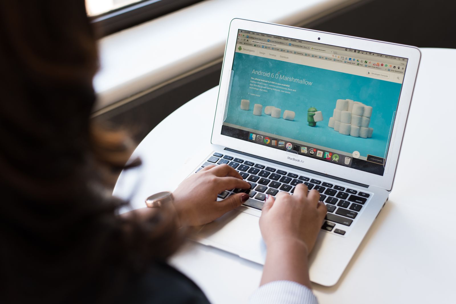 A person working on a laptop showing a web page, representing page loading that LCP measures