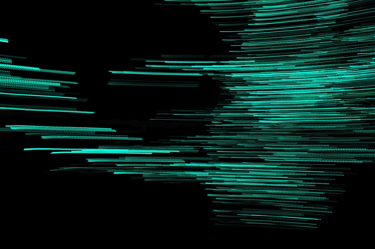 Flowing light trails against a dark background.